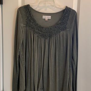 Olive colored long sleeve soft top.